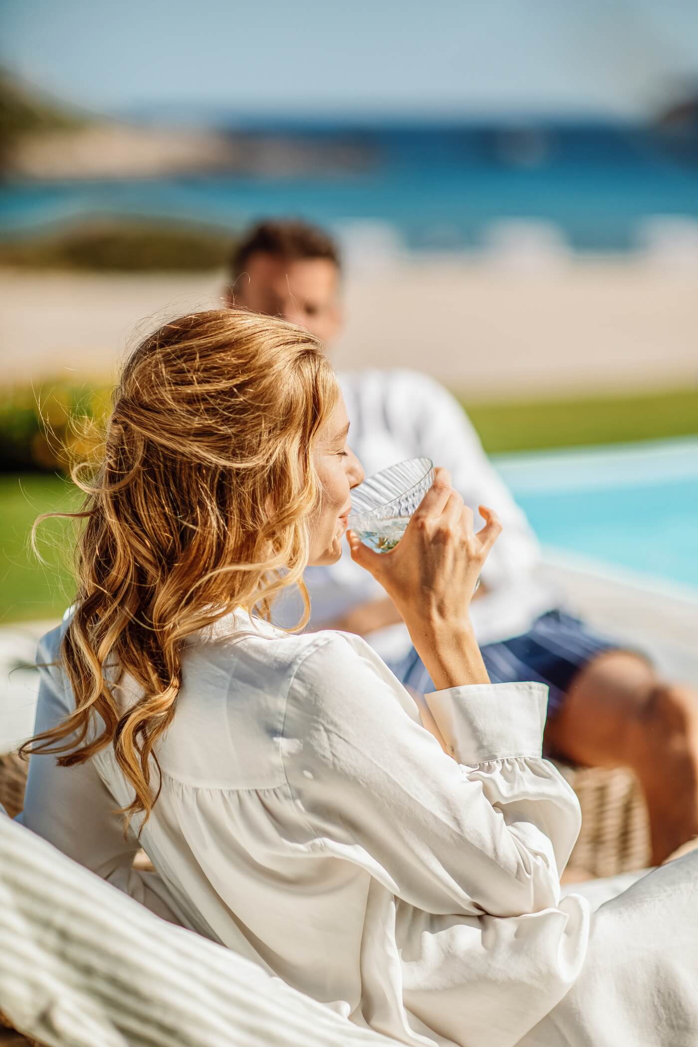 Woman sipping cocktails