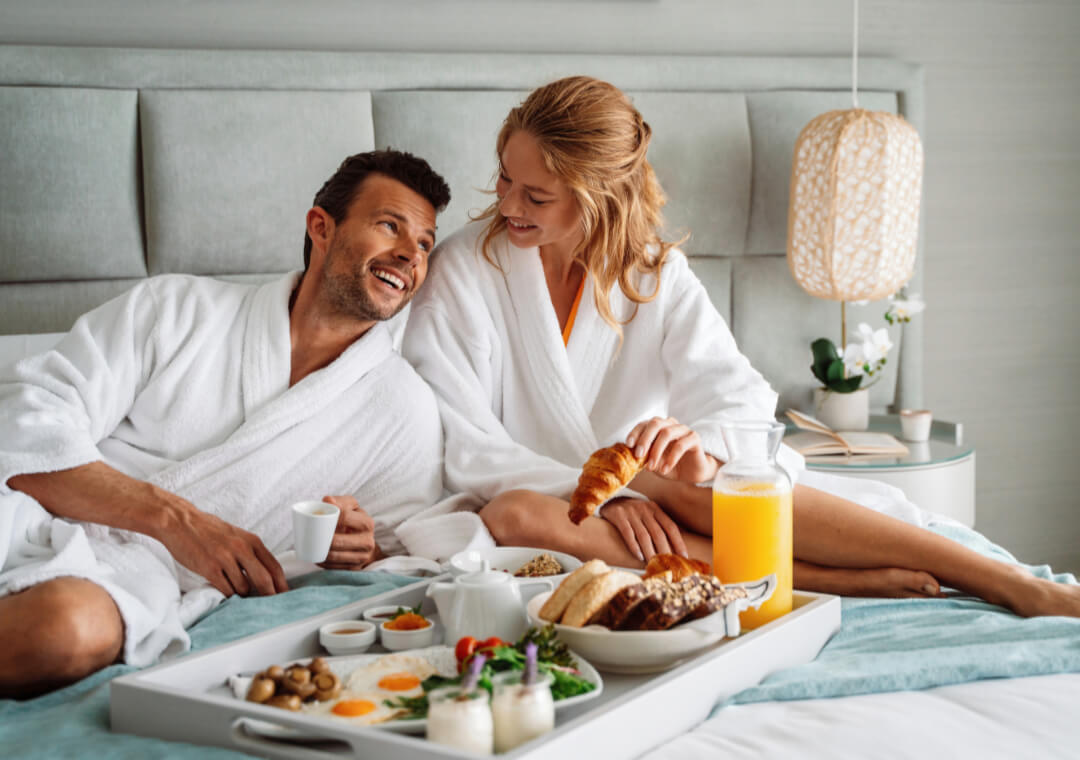 ikos-resorts_couple-relaxing-on-the-bed_2880x1920-1