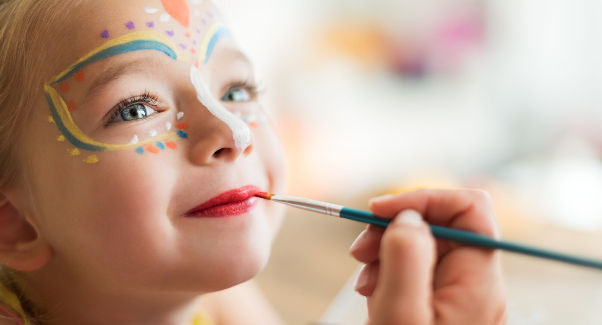 Kids face painting at Ikos